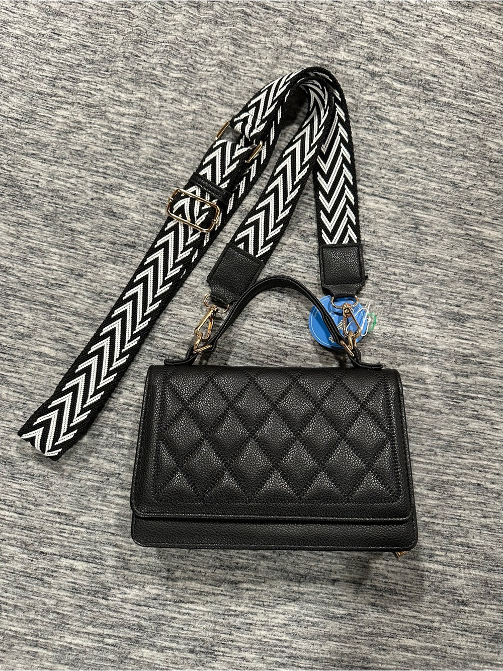 Quilted Black Leather Top-Handle Crossbody Bag with Striped Strap